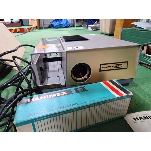 64 - A Hanimex 2000 TRF slide projector with 2 universal magazines in good clean condition.