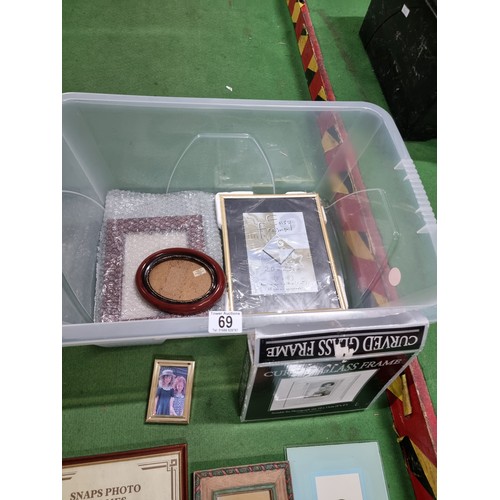 69 - A box full of various photo frames to include thick glass photo frames, glazed picture frames, etc, ... 