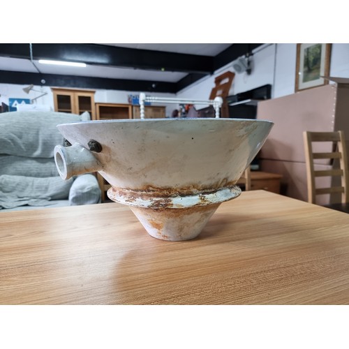 72 - An antique ceramic blue and white toilet bowl, removed from Powis Castle with a intricate scene with... 