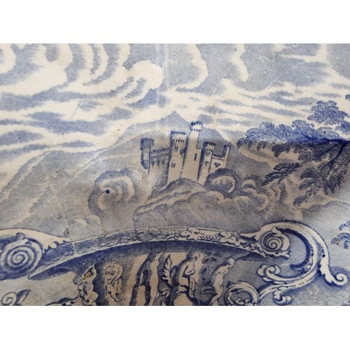 72 - An antique ceramic blue and white toilet bowl, removed from Powis Castle with a intricate scene with... 