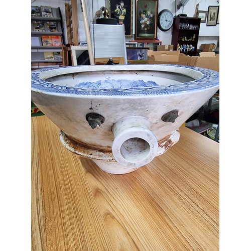 72 - An antique ceramic blue and white toilet bowl, removed from Powis Castle with a intricate scene with... 