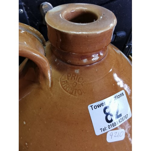 82 - Earthen ware flagon Price O Bristol with small chip to the lid along with one other flagon measures ... 