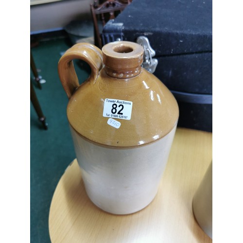 82 - Earthen ware flagon Price O Bristol with small chip to the lid along with one other flagon measures ... 