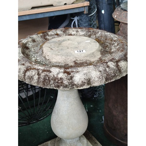 127 - Stone pedestal bird bath in good order with good patina separates into three section and is 78cm hig... 