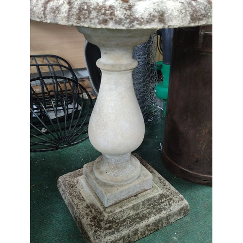 127 - Stone pedestal bird bath in good order with good patina separates into three section and is 78cm hig... 