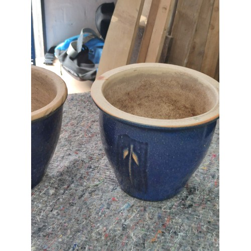 134 - 2 x dark blue glazed planters one with leaf design both good order tallest 22cm and 27cm wide