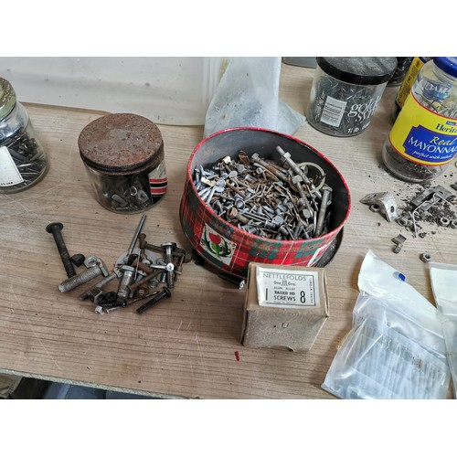 161 - Large collection of jars containing a qunatity of screws, washers, nails etc