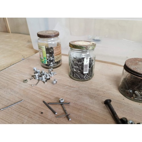 161 - Large collection of jars containing a qunatity of screws, washers, nails etc