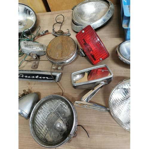 186 - 2x boxes containing a quantity of vintage car lights, hub caps, austin boot badge, wing mirrors etc