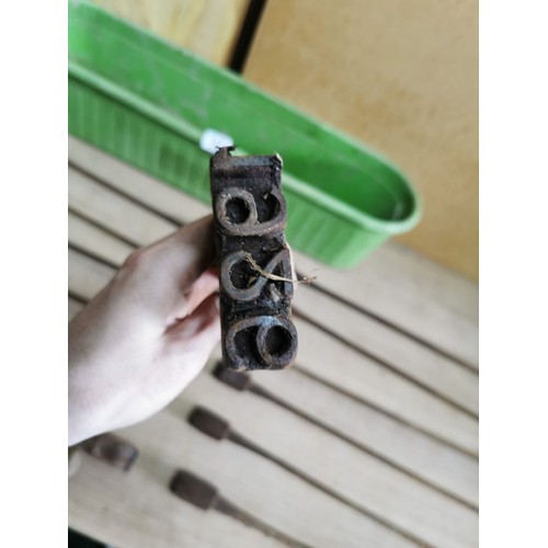 187 - Large quantity of vintage branding irons in a plastic trug, mostly with different letters or numbers... 