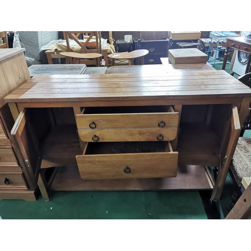 397 - Solid beech side board with a purposely aged design featuring two doors and two drawers with ring ha... 