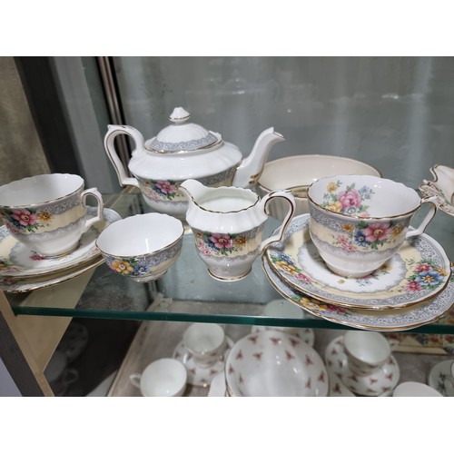 80A - A large comprehensive quantity of part/tea sets with various makers to include Crown Staffordshire, ... 