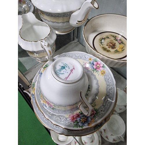 80A - A large comprehensive quantity of part/tea sets with various makers to include Crown Staffordshire, ... 