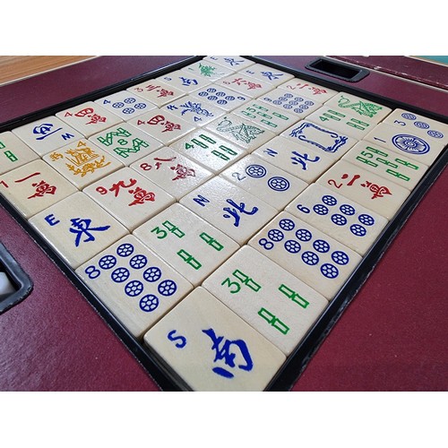 23 - A vintage boxed Mah Jong Chinese game wtih 144 wooden playing pieces and dices .