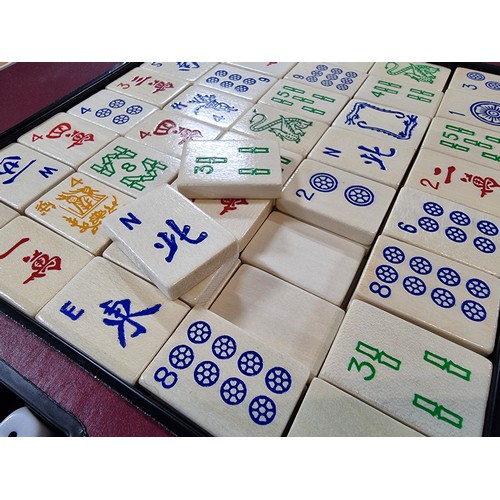 23 - A vintage boxed Mah Jong Chinese game wtih 144 wooden playing pieces and dices .