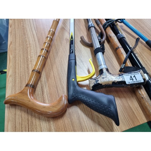 41 - A bundle of 8x various walking sticks and grabbers, all in good condition.