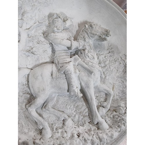 351 - A pair of large chalk 3d chargers with 2 scenes depicting gentlemen on horses, possibly from Don Qui... 