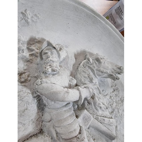 351 - A pair of large chalk 3d chargers with 2 scenes depicting gentlemen on horses, possibly from Don Qui... 