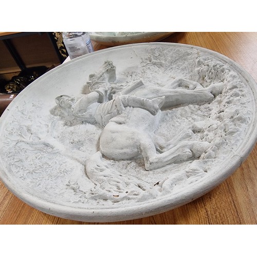 351 - A pair of large chalk 3d chargers with 2 scenes depicting gentlemen on horses, possibly from Don Qui... 