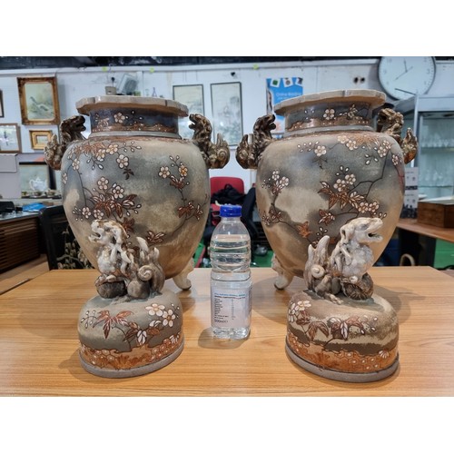 363 - A pair of good quality antique Chinese lidded temple vases with a pretty design with overlaid enamel... 