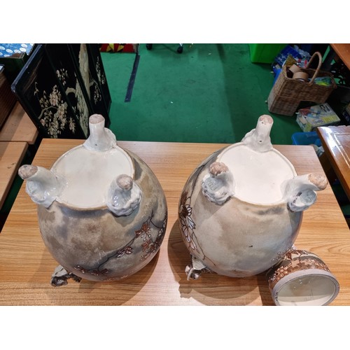 363 - A pair of good quality antique Chinese lidded temple vases with a pretty design with overlaid enamel... 