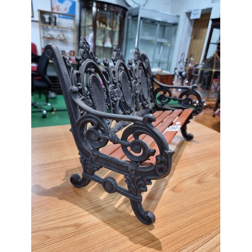 365 - A good quality miniature ornamental cast iron bench with wooden slats, in excellent clean condition ... 