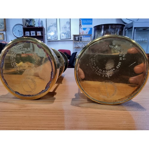 368 - a pair of brass Cymru miners lamps by Nedd products ltd in Glamorgan. Height of 22cm, diameter 9cm.