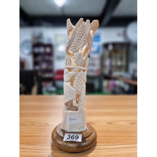 369 - A vintage carved ox bone ornament made in Israel of a scene of two people handling fruit, marked Isr... 