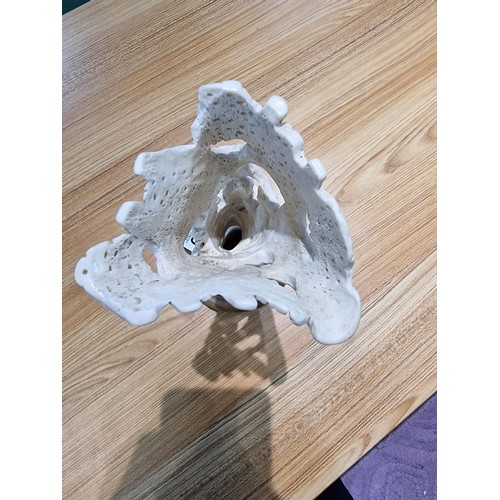 369 - A vintage carved ox bone ornament made in Israel of a scene of two people handling fruit, marked Isr... 
