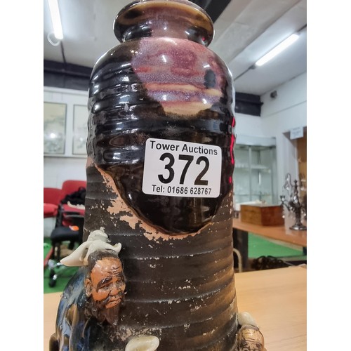 372 - An antique Japanese Sumida Gawa drip glaze vase signed to the rear by Ishiguro Koko with overlaid 3d... 