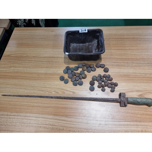 374 - A large collection of vintage military buttons along with a bayonet.