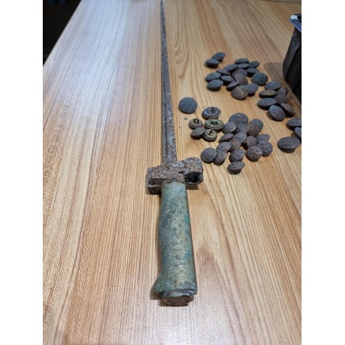 374 - A large collection of vintage military buttons along with a bayonet.