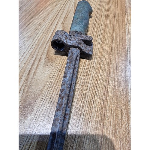 374 - A large collection of vintage military buttons along with a bayonet.
