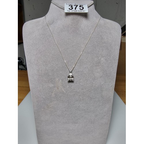 375 - A 925 silver pendant inset with a large smoky CZ stone set on  a 18