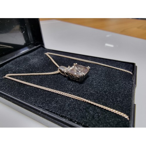 375 - A 925 silver pendant inset with a large smoky CZ stone set on  a 18