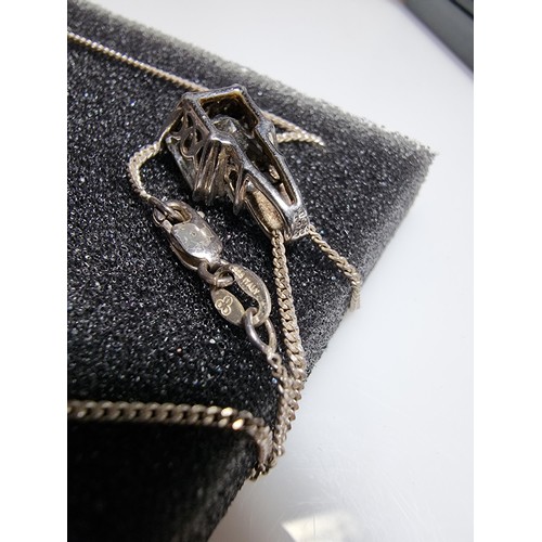 375 - A 925 silver pendant inset with a large smoky CZ stone set on  a 18