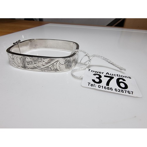 376 - A tested as sterling silver 3 piece bangle, along with an ornate engraved 925 silver hinged bracelet... 