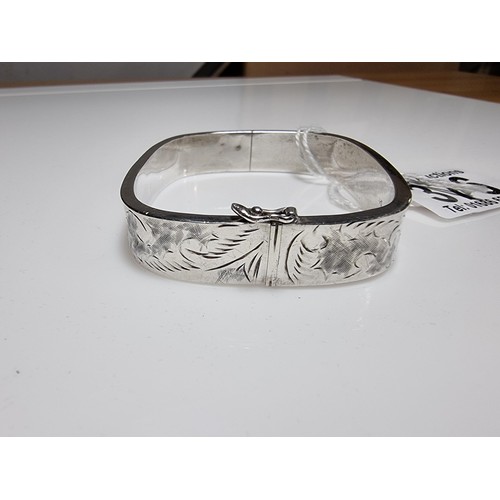 376 - A tested as sterling silver 3 piece bangle, along with an ornate engraved 925 silver hinged bracelet... 