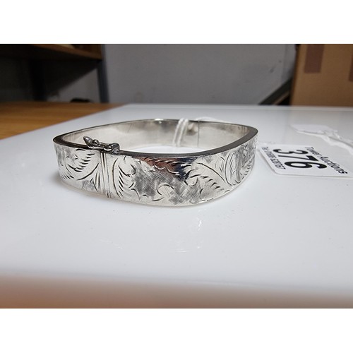 376 - A tested as sterling silver 3 piece bangle, along with an ornate engraved 925 silver hinged bracelet... 