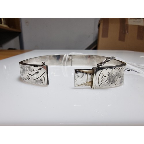 376 - A tested as sterling silver 3 piece bangle, along with an ornate engraved 925 silver hinged bracelet... 