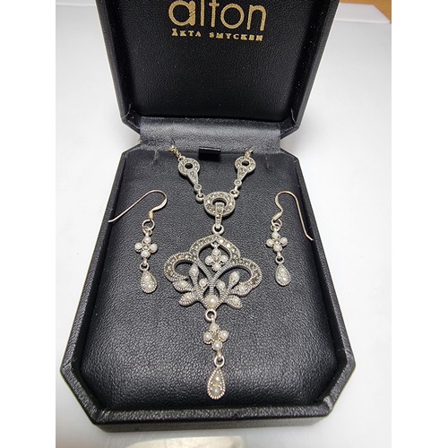 378 - A boxed pretty 925 silver matching jewellery set including a necklace inset with marcasite stones an... 