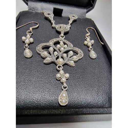 378 - A boxed pretty 925 silver matching jewellery set including a necklace inset with marcasite stones an... 