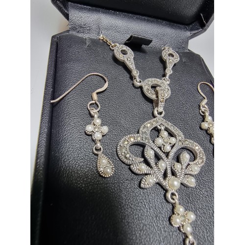378 - A boxed pretty 925 silver matching jewellery set including a necklace inset with marcasite stones an... 