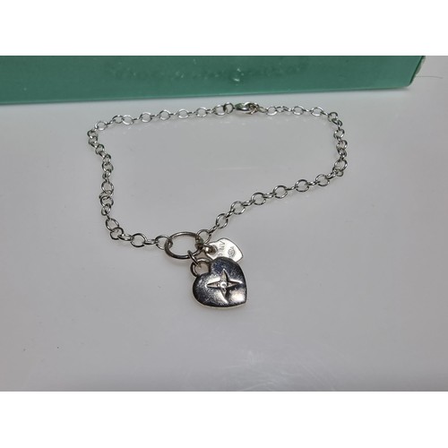 381 - A quantity of various costume jewellery including a charm bracelet, various chains, a 925 silver bra... 