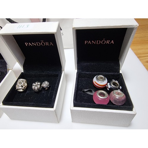 382 - A large collection of various charms including a genuine Pandora silver part charm marked 925 ALE al... 