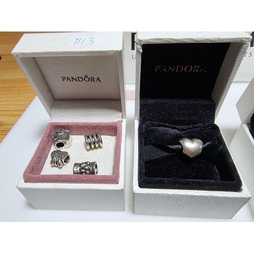 382 - A large collection of various charms including a genuine Pandora silver part charm marked 925 ALE al... 