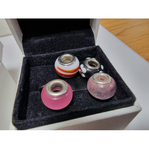382 - A large collection of various charms including a genuine Pandora silver part charm marked 925 ALE al... 