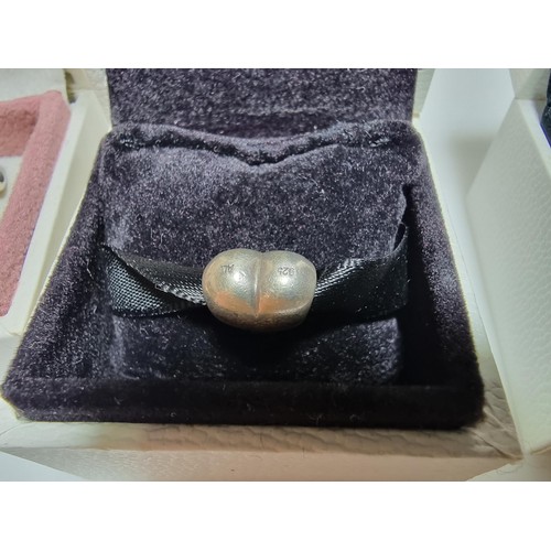382 - A large collection of various charms including a genuine Pandora silver part charm marked 925 ALE al... 