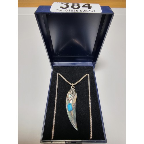 384 - A pretty ornate 925 silver pendant on an 18