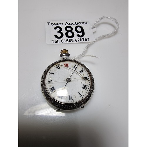 389 - A 925 silver fob watch with an ornate engraved case, the watch glass needs replacing but the dial is... 